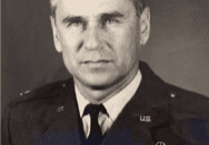 Black and white portrait of a man in uniform.